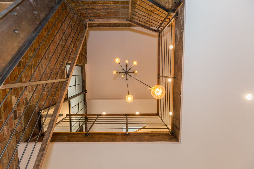 parish house adaptive reuse stairway view from bottom
